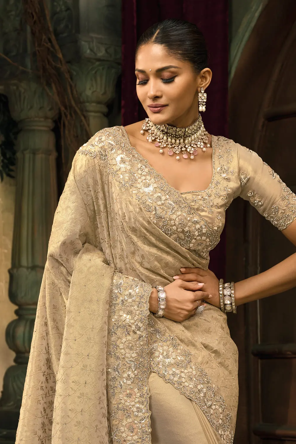 Cream kanjivaram silk saree folded showing heavy work on border and body