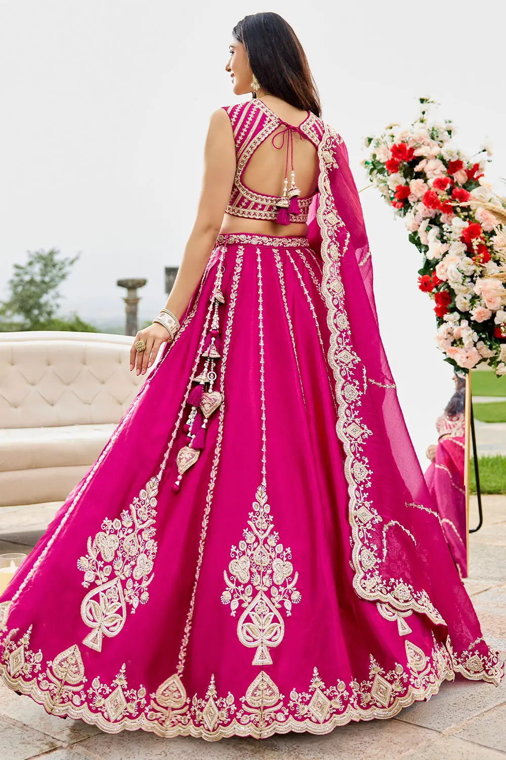 Hot pink lehenga paired with gold jewellery – complete bridal look