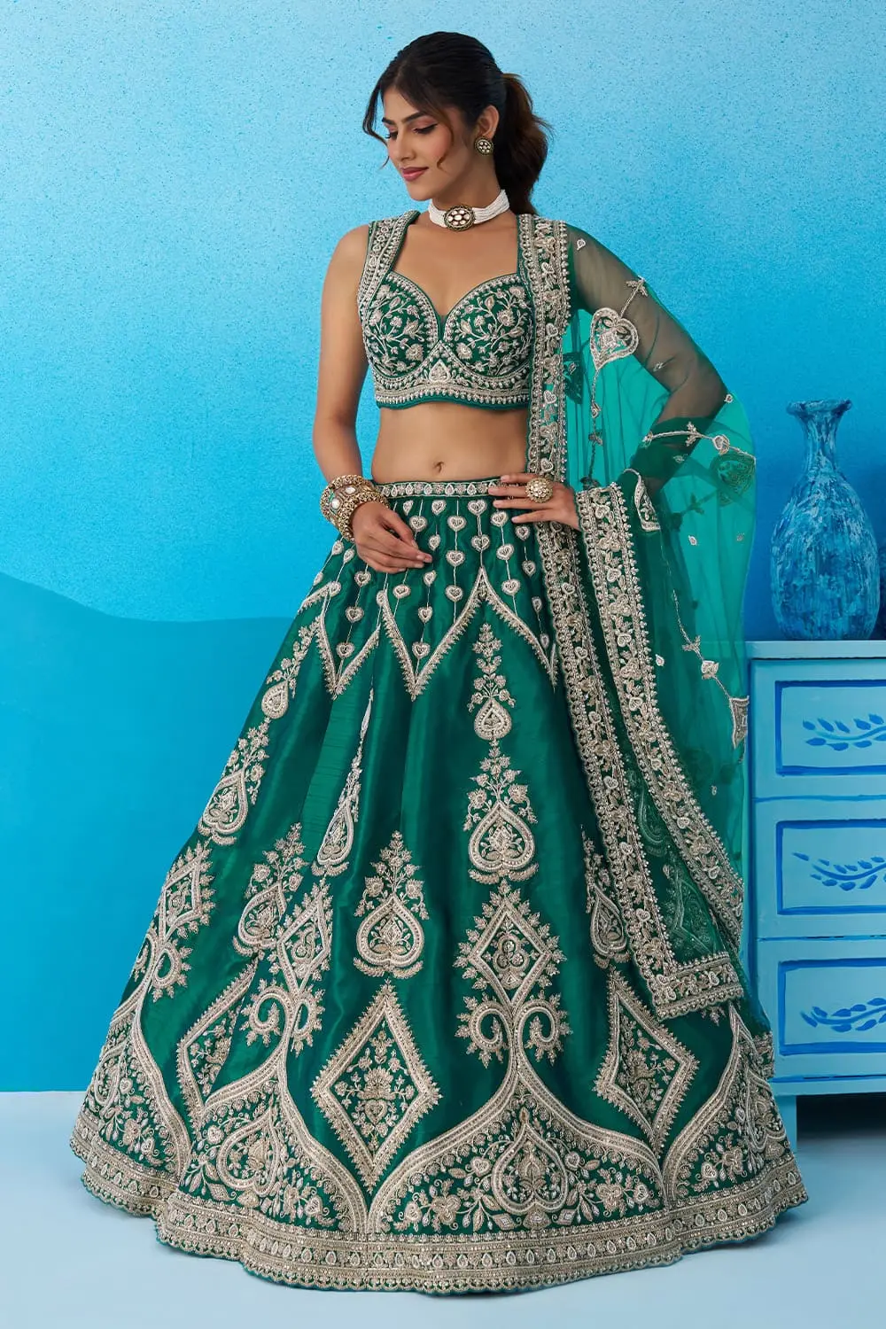 Heavy latkan tassels and cut-work border of Teal Blue Banarasi Silk Lehenga