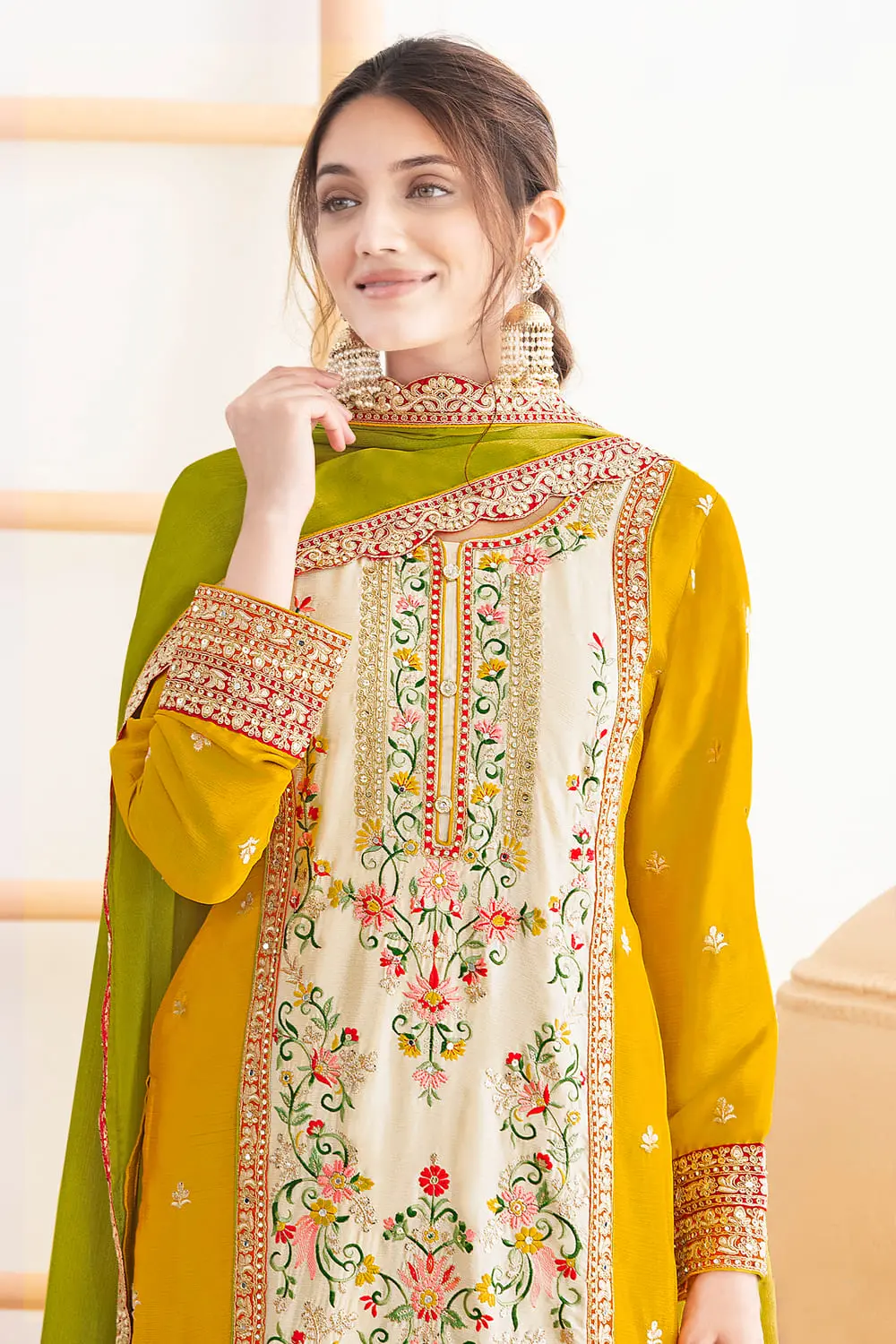 Hand stitched mirrors and dabka dori work on green chinon kurta