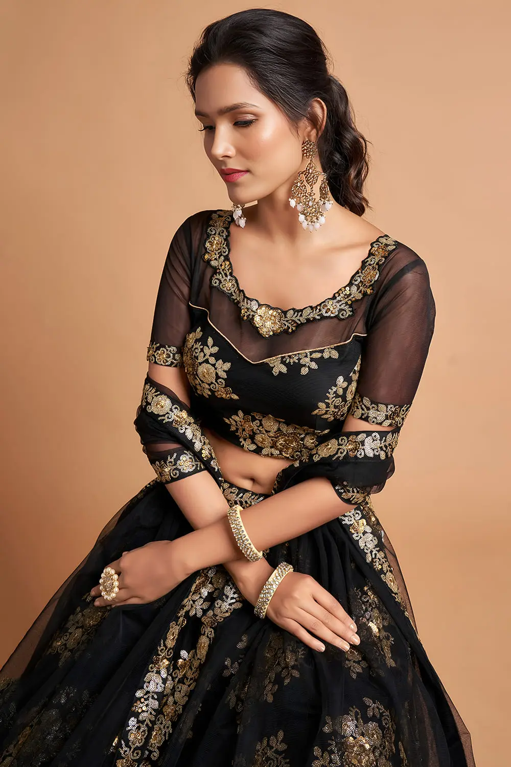 Bride wearing Black Soft Net Lehenga set during a wedding ceremony.