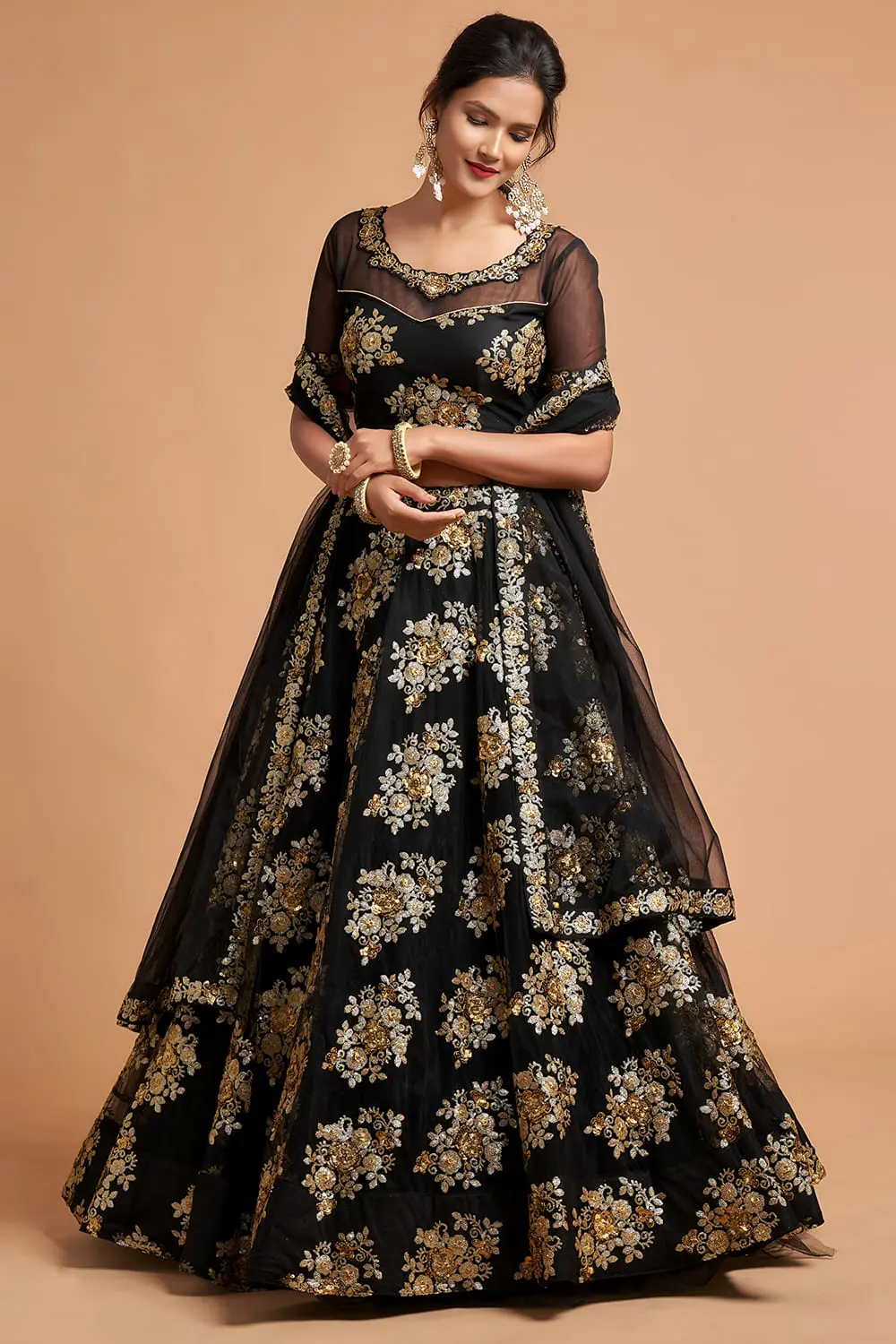 Detailed macro of sequins and zari motifs on a Black Soft Net Lehenga.