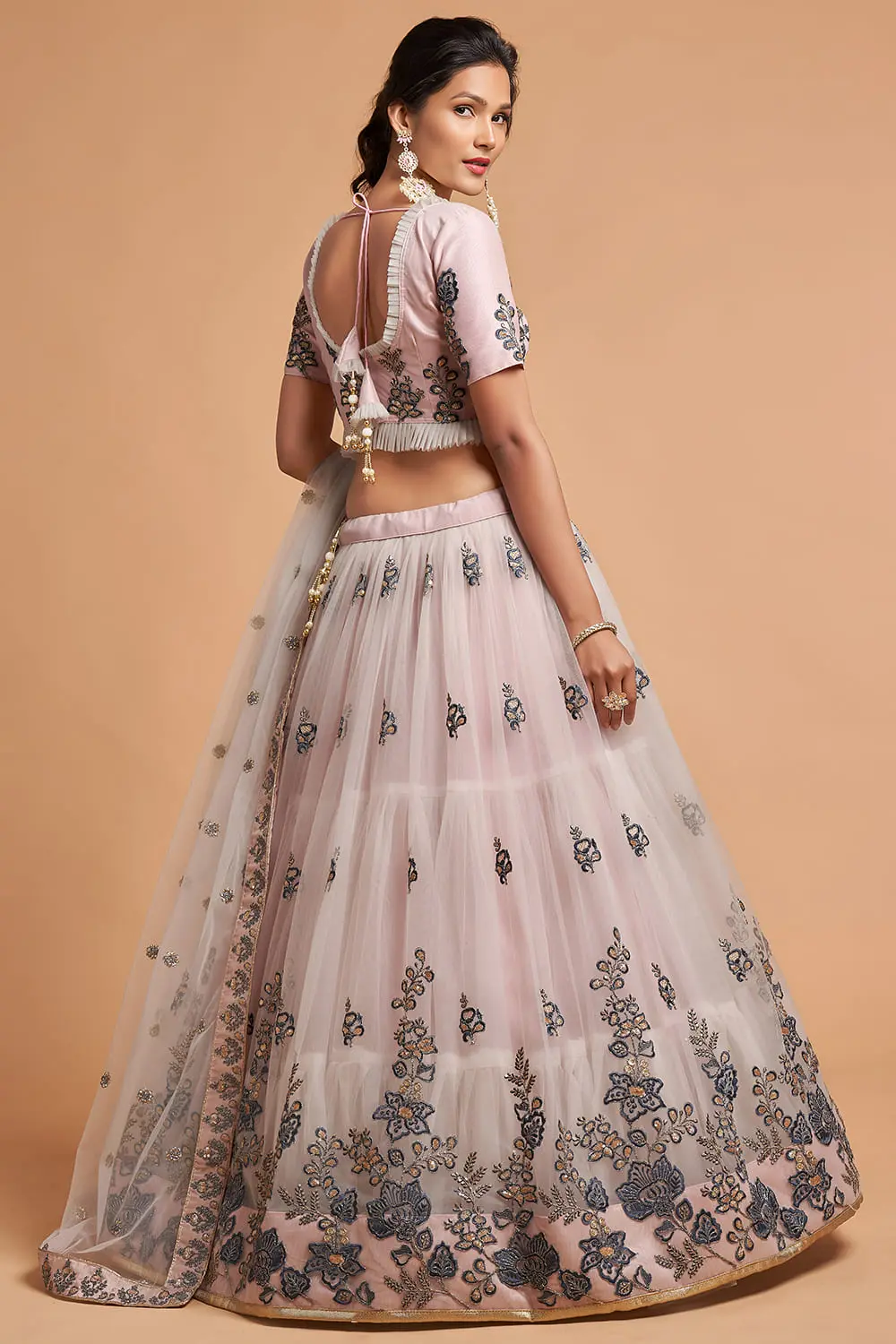 Back view of the Grey Soft Net Lehenga blouse, highlighting the long sleeves and zari cuff.