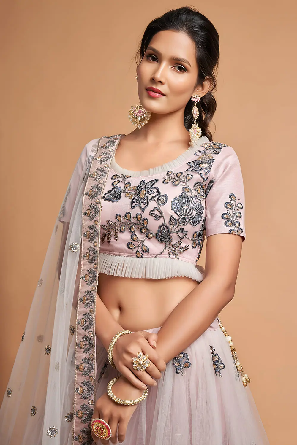 Close-up of the intricate zari border and multi-sequin work on the Grey Soft Net Lehenga.