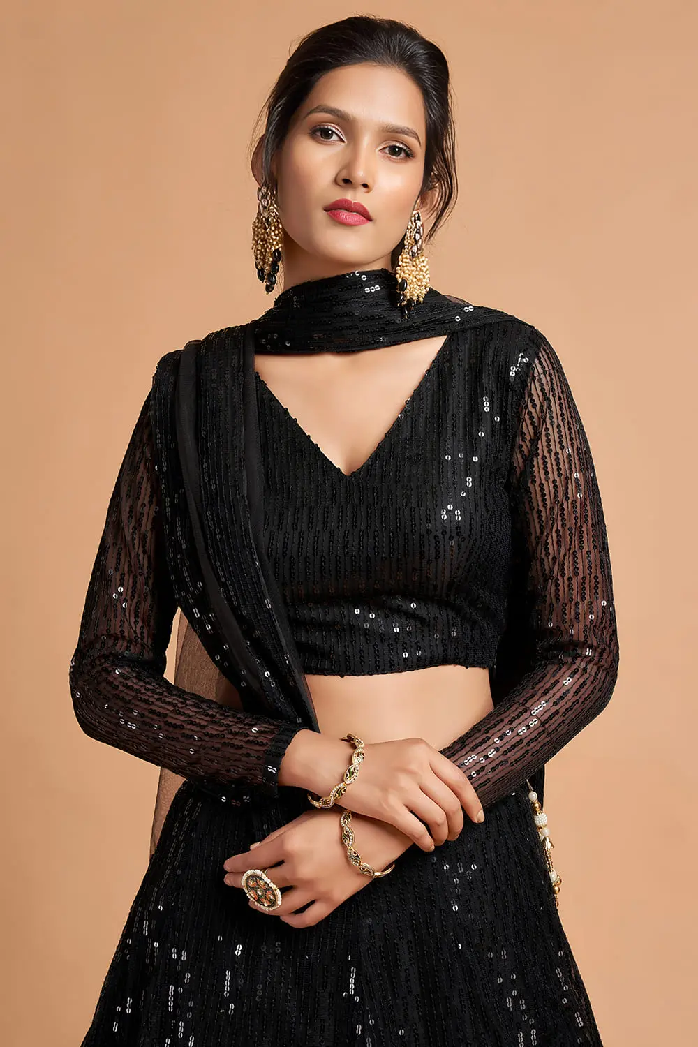 Mid-dance capture of the Black Net Lehenga in motion, highlighting sequin shimmer.