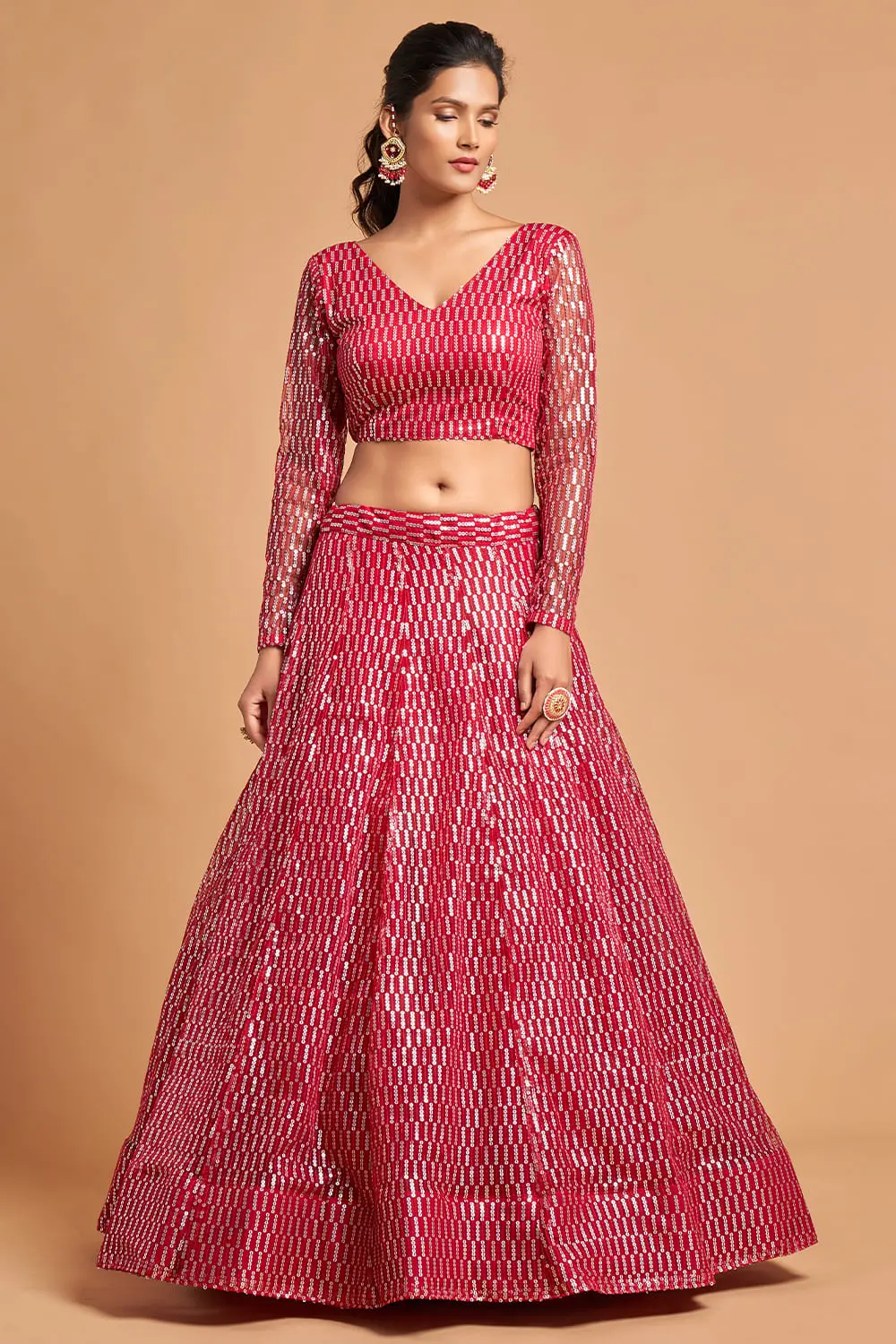 A curvy model wearing the Pink Net Lehenga, demonstrating the plus size friendly blouse.