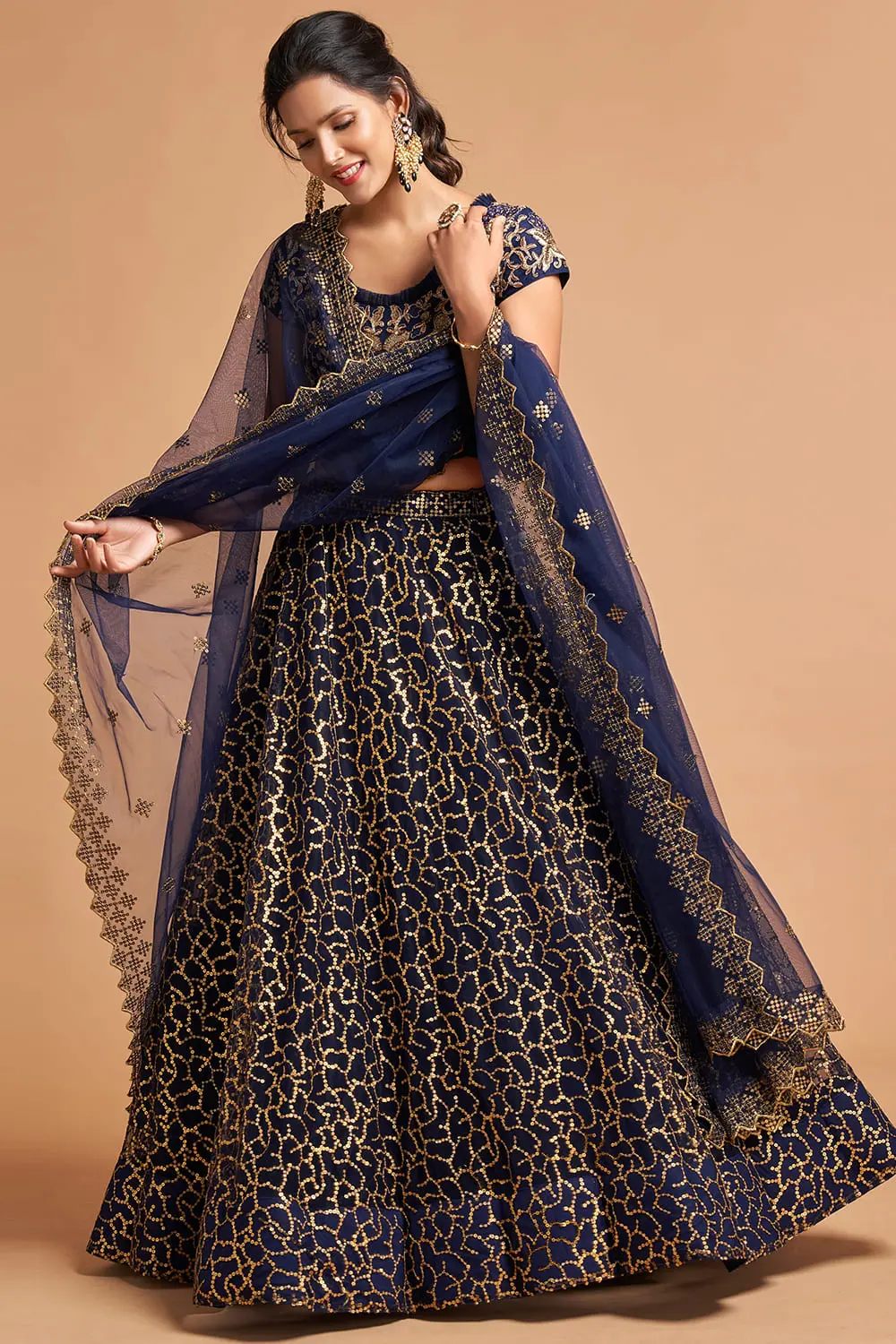 Flat-lay of the Navy Blue Net Lehenga set with dupatta, silver clutch, and matching potli.
