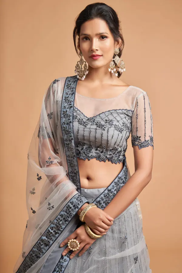 Close-up detail of the sequin and zari work on the Light Grey Net Lehenga’s soft net skirt.