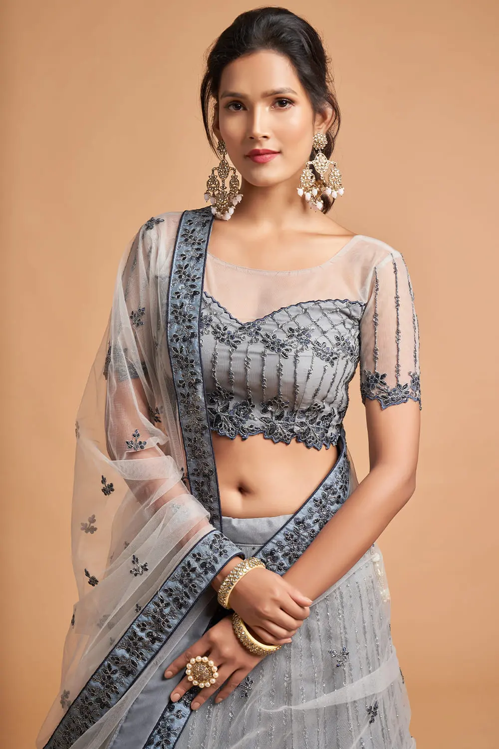 Close-up detail of the sequin and zari work on the Light Grey Net Lehenga’s soft net skirt.