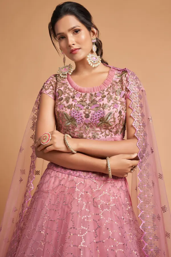 Close-up of sequin and zari floral motifs on the Dusty Pink Net Lehenga’s soft net skirt.
