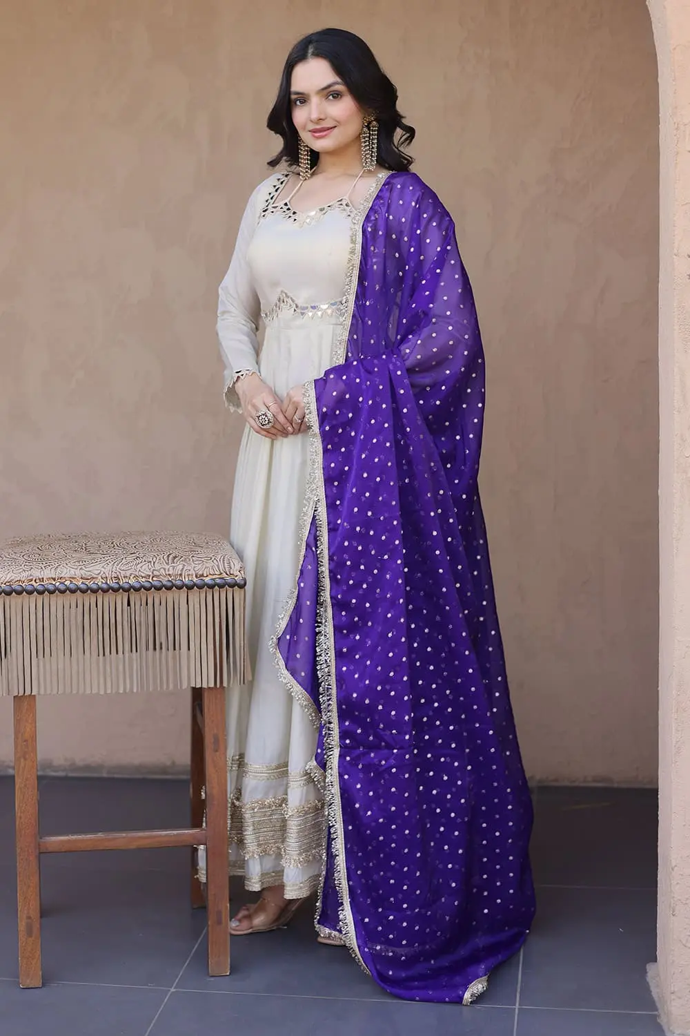 Full view of ivory anarkali gown styled with blue moss butti dupatta