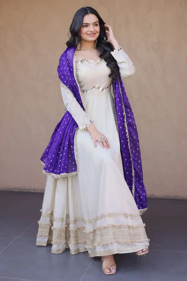 Ivory anarkali gown with blue dupatta and real mirror work by Khaish