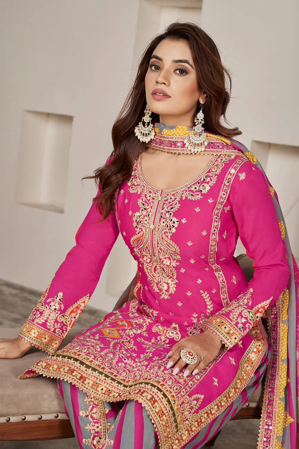 Embroidered daman with mirror work and dabka dori on pink kurta hem