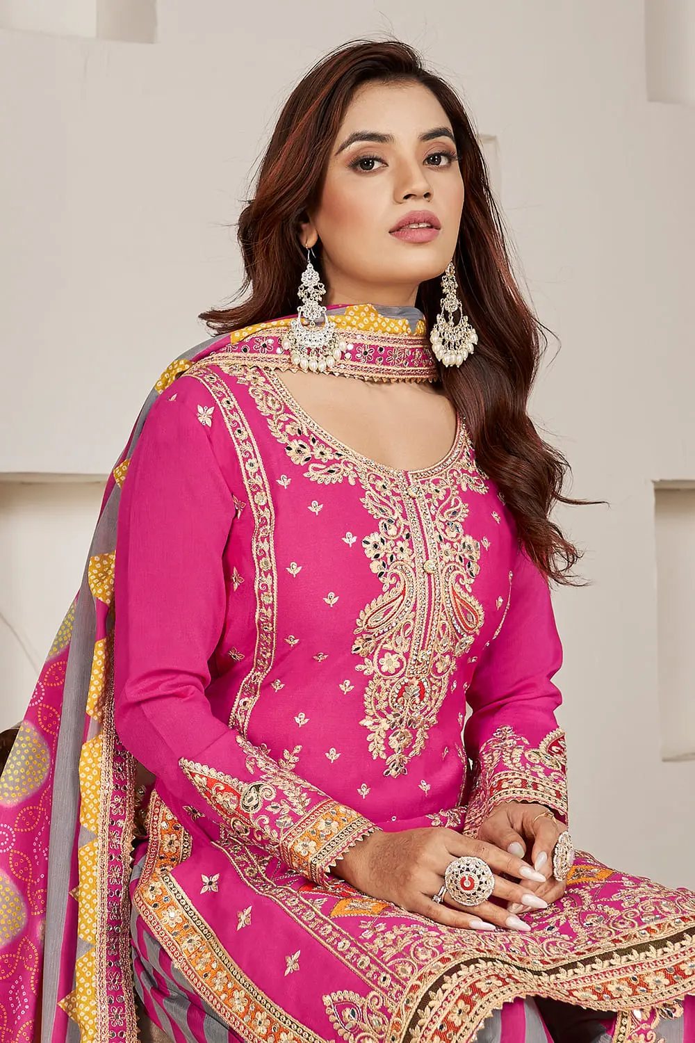 Handmade mirror work and dabka dori embroidery on deep pink chinon kurta yoke
