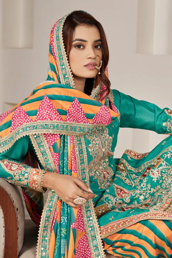 Handmade mirror work and dabka dori embroidery on teal chinon kurta yoke