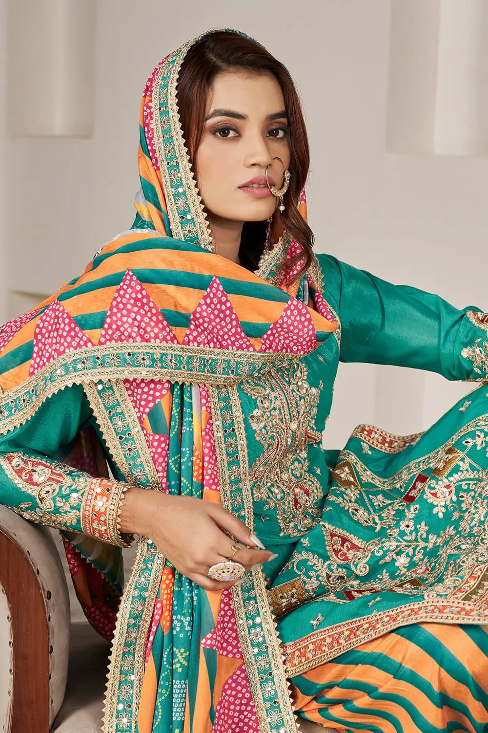 Handmade mirror work and dabka dori embroidery on teal chinon kurta yoke