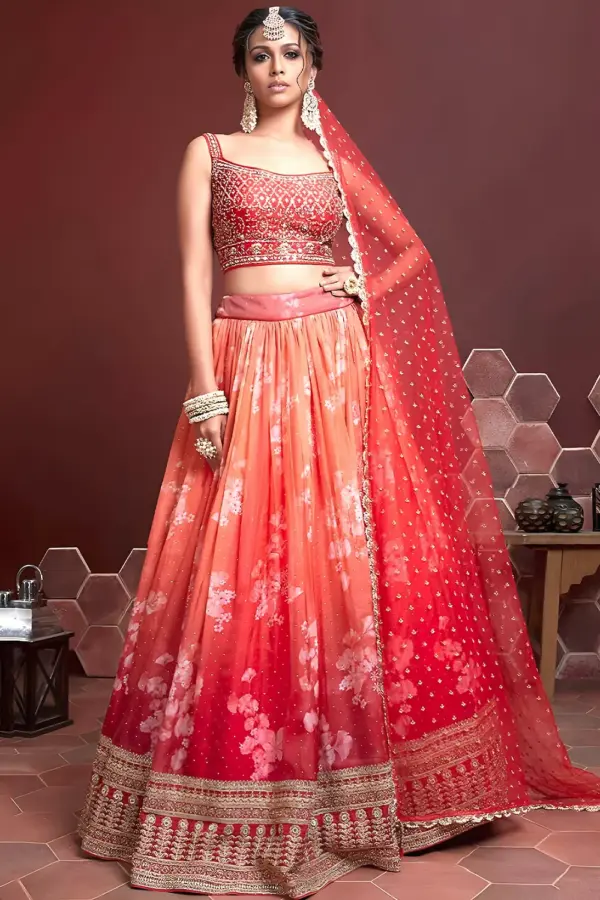 Orange silk lehenga with Swarovski, digital print and heavy embroidery by Khaish
