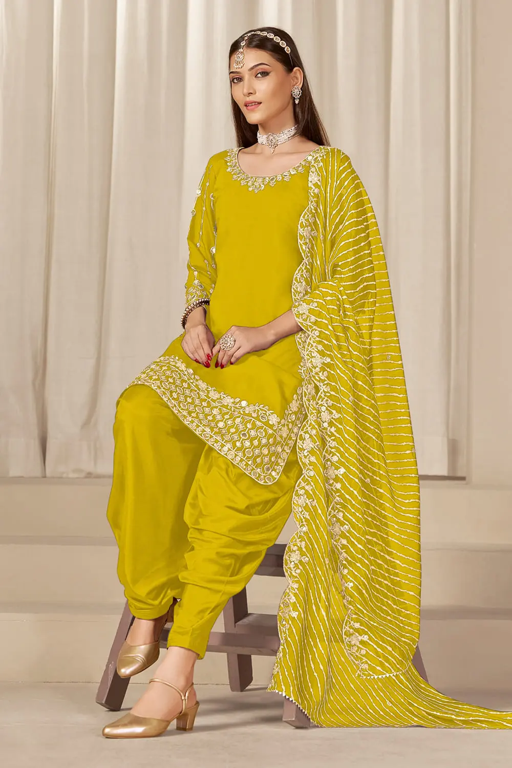 Pleated patiala salwar with soft organza dupatta in sunny yellow