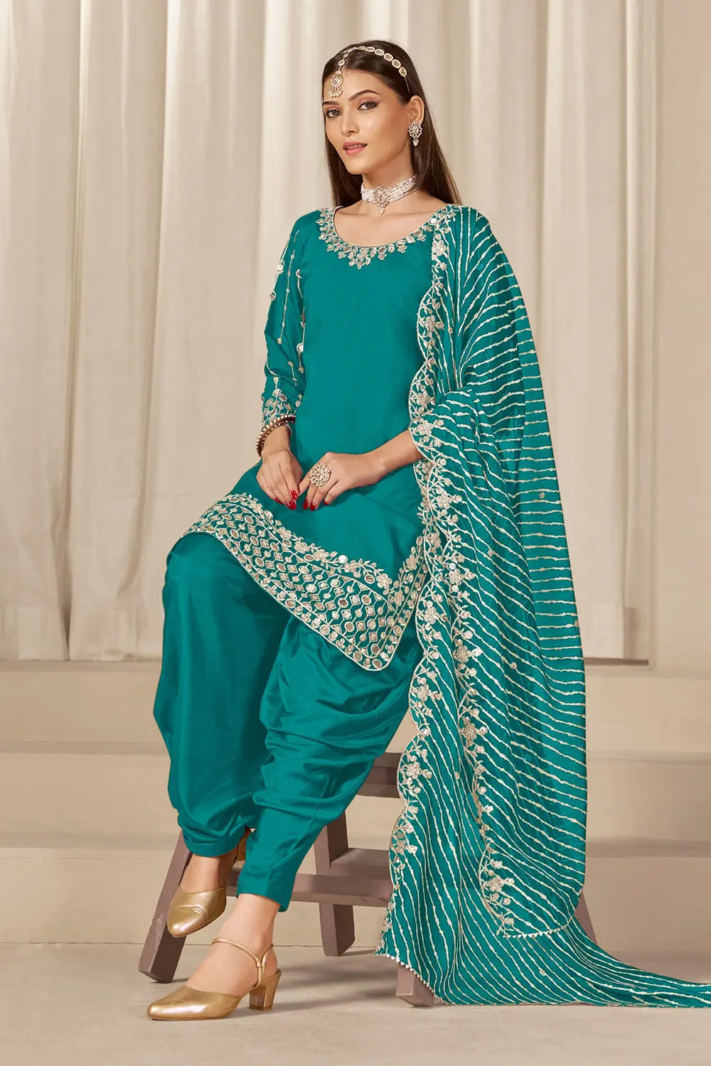 Pleated teal patiala salwar with soft organza dupatta