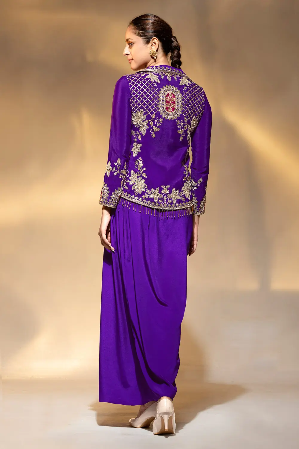 Side view of purple drape suit set showing cowl drape and collar lines