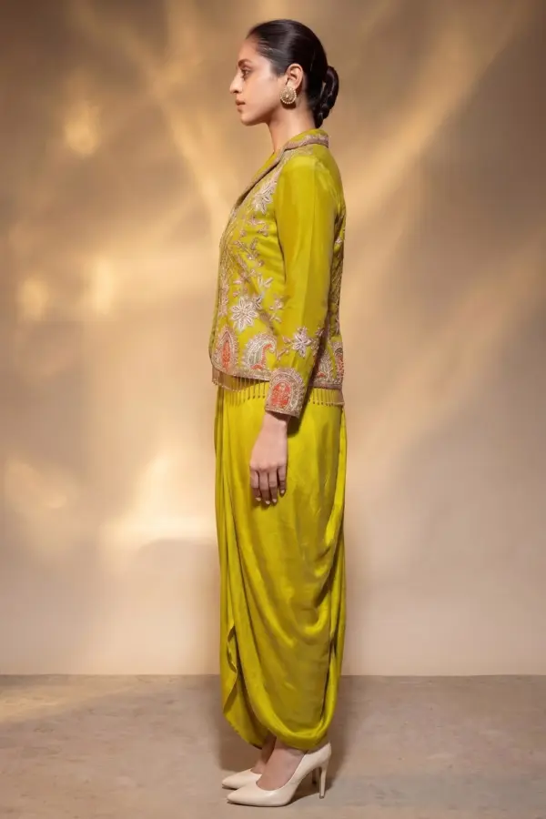 Side view of mustard suit jacket and cowl skirt set by Khaish