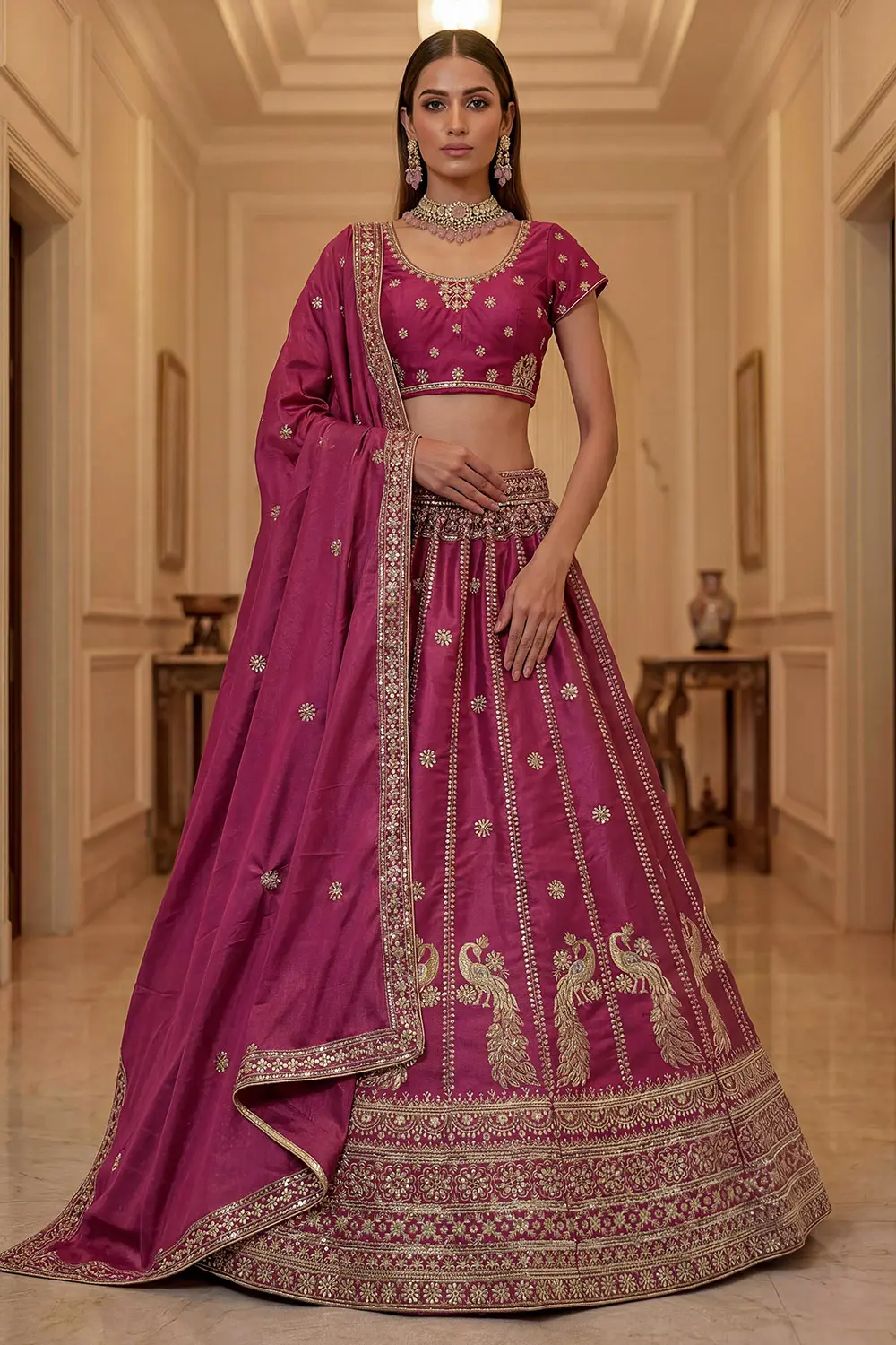 Pink silk lehenga styled with matching embroidered blouse and dupatta
