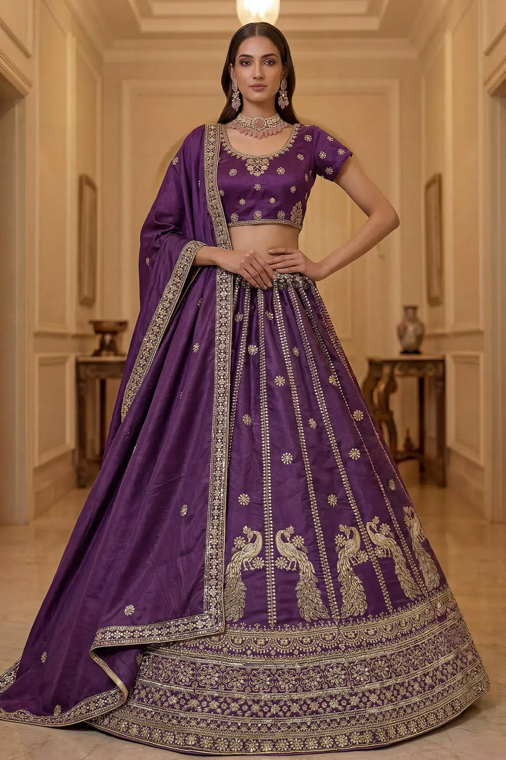 Purple silk lehenga styled with matching embroidered blouse and dupatta