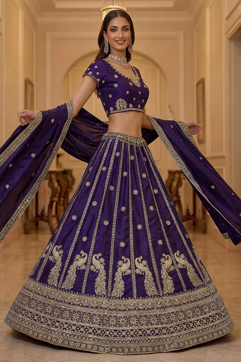 Dark purple silk lehenga styled with matching embroidered blouse and dupatta