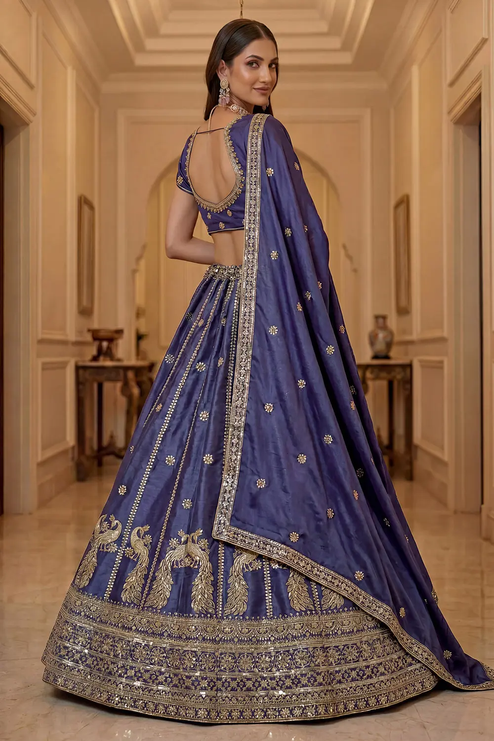 Gold zari embroidery and sequins on peacock blue silk lehenga skirt