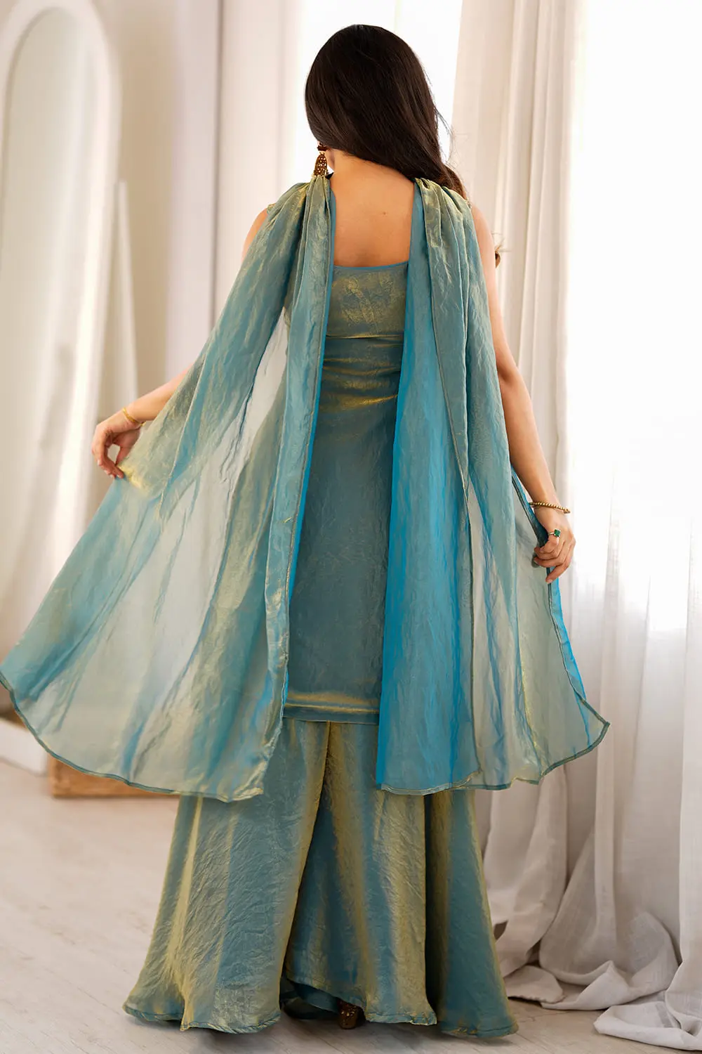 Back view of teal green silk kurta sharara set