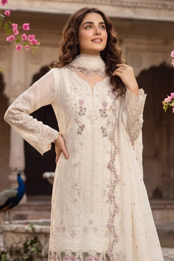 Close up of hand moti and khatli embroidery on white chiffon kurta