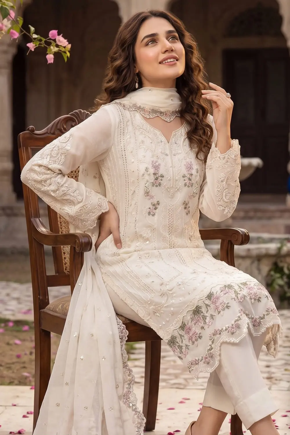 Close up of embroidered white chiffon kurta top with beadwork
