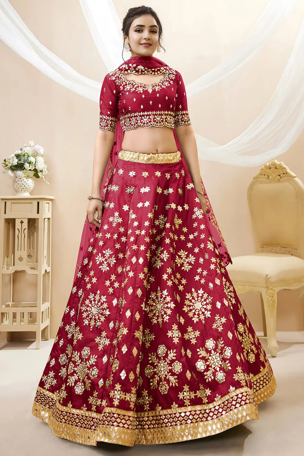 Red art silk lehenga with foil and zari embroidery and net dupatta