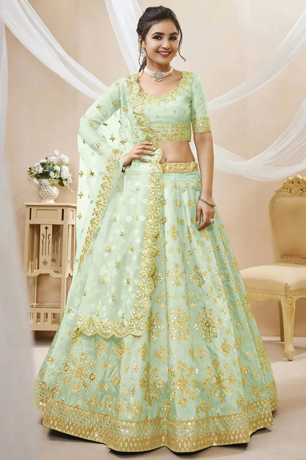 Pista green art silk lehenga with foil and zari embroidery and net dupatta