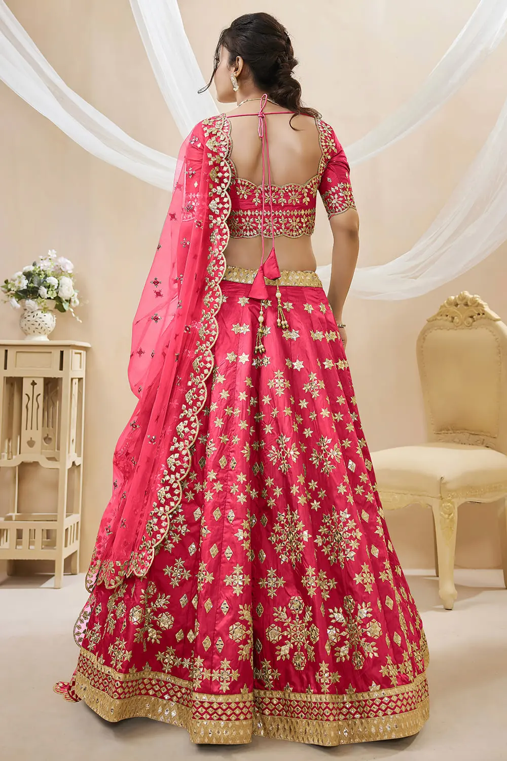 Back view of pink art silk lehenga choli with embroidered blouse