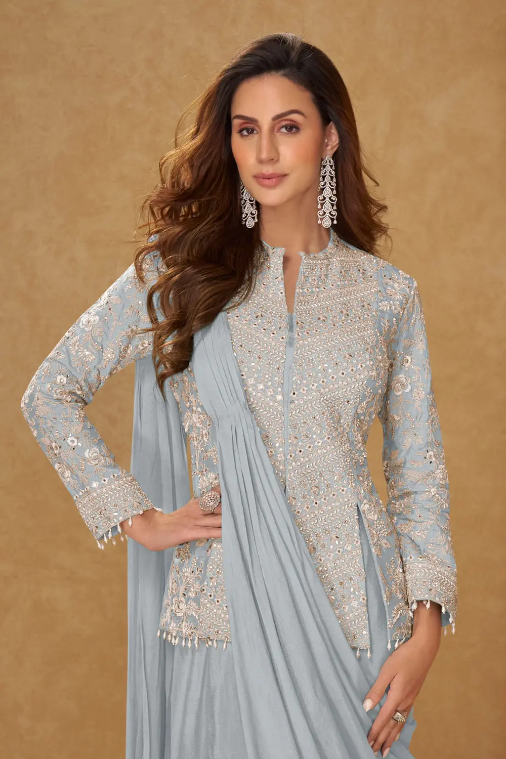 Light blue chinon silk saree styled with embroidered jacket