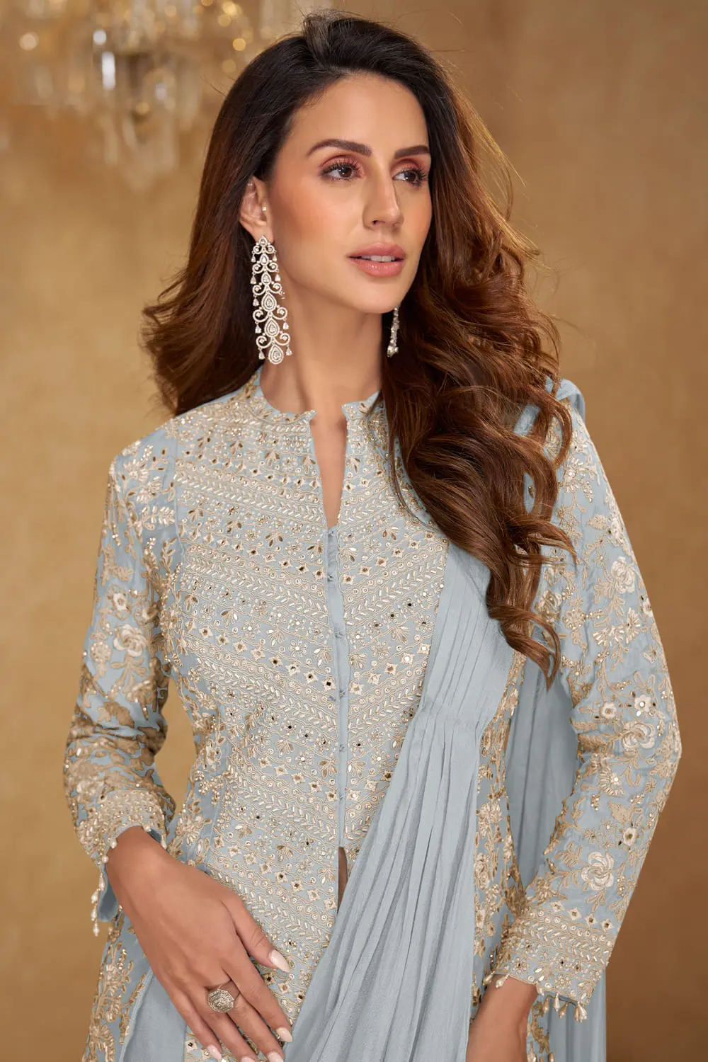 Embroidery work and tassel lace detail on light blue jacket saree