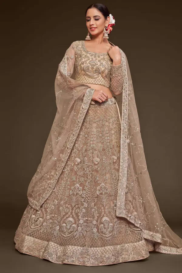 Gold net lehenga choli for party with badla and zari embroidery by Khaish
