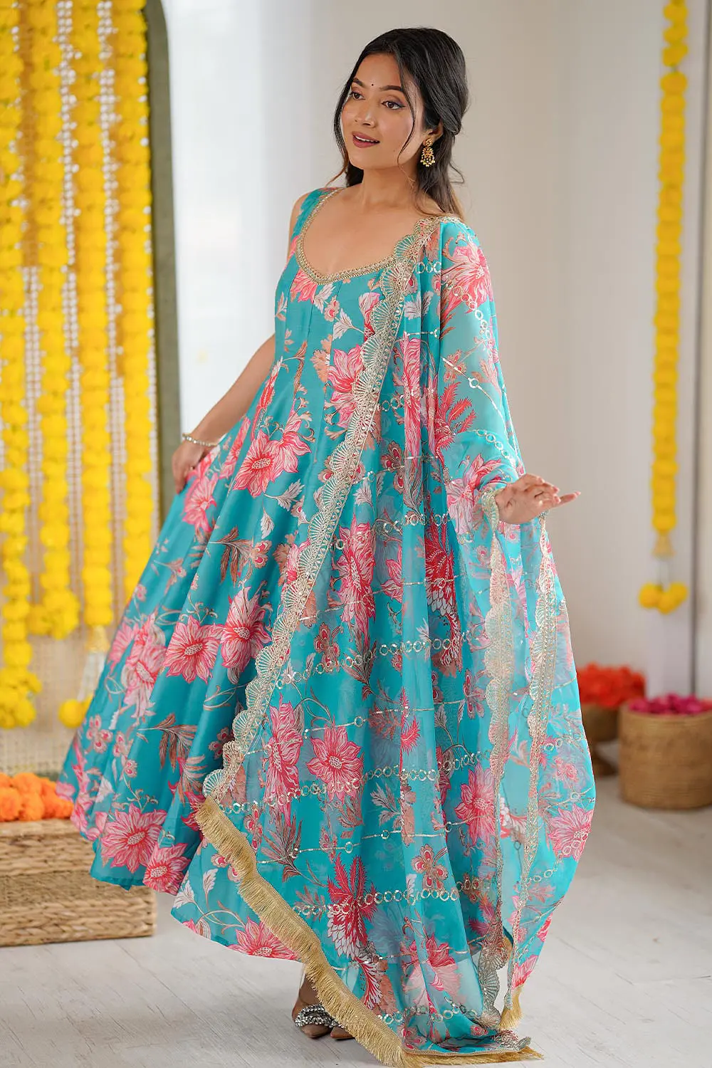 Side view of sky blue floral muslin anarkali gown with pant