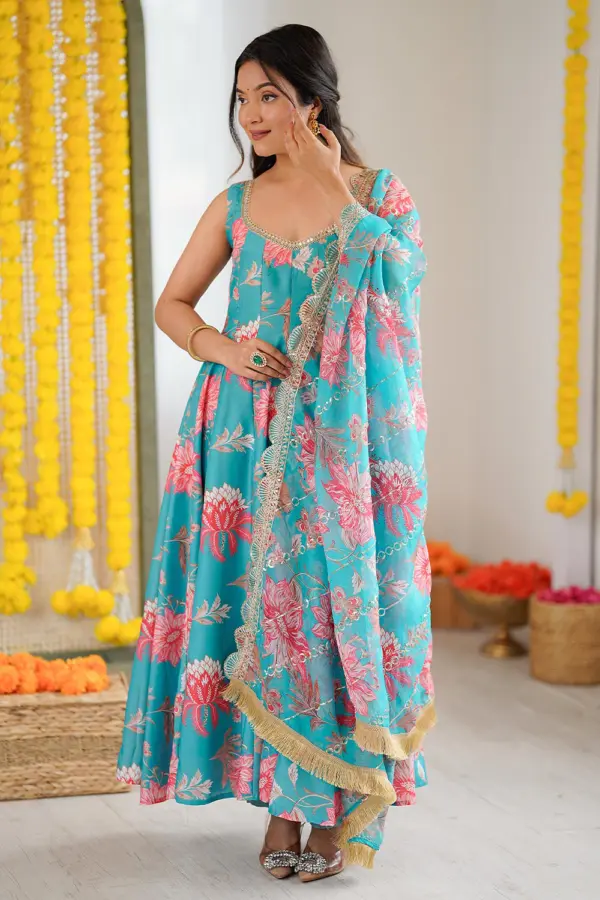 Sky blue muslin anarkali gown with pant in pure floral print by Khaish