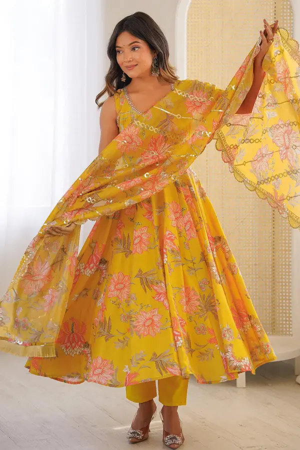 Mustard muslin anarkali gown with pant in pure floral print by Khaish