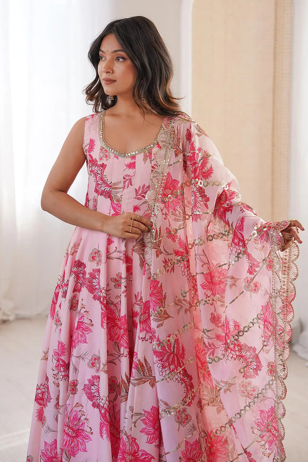 Close up of floral print and organza sequins dupatta on pink anarkali