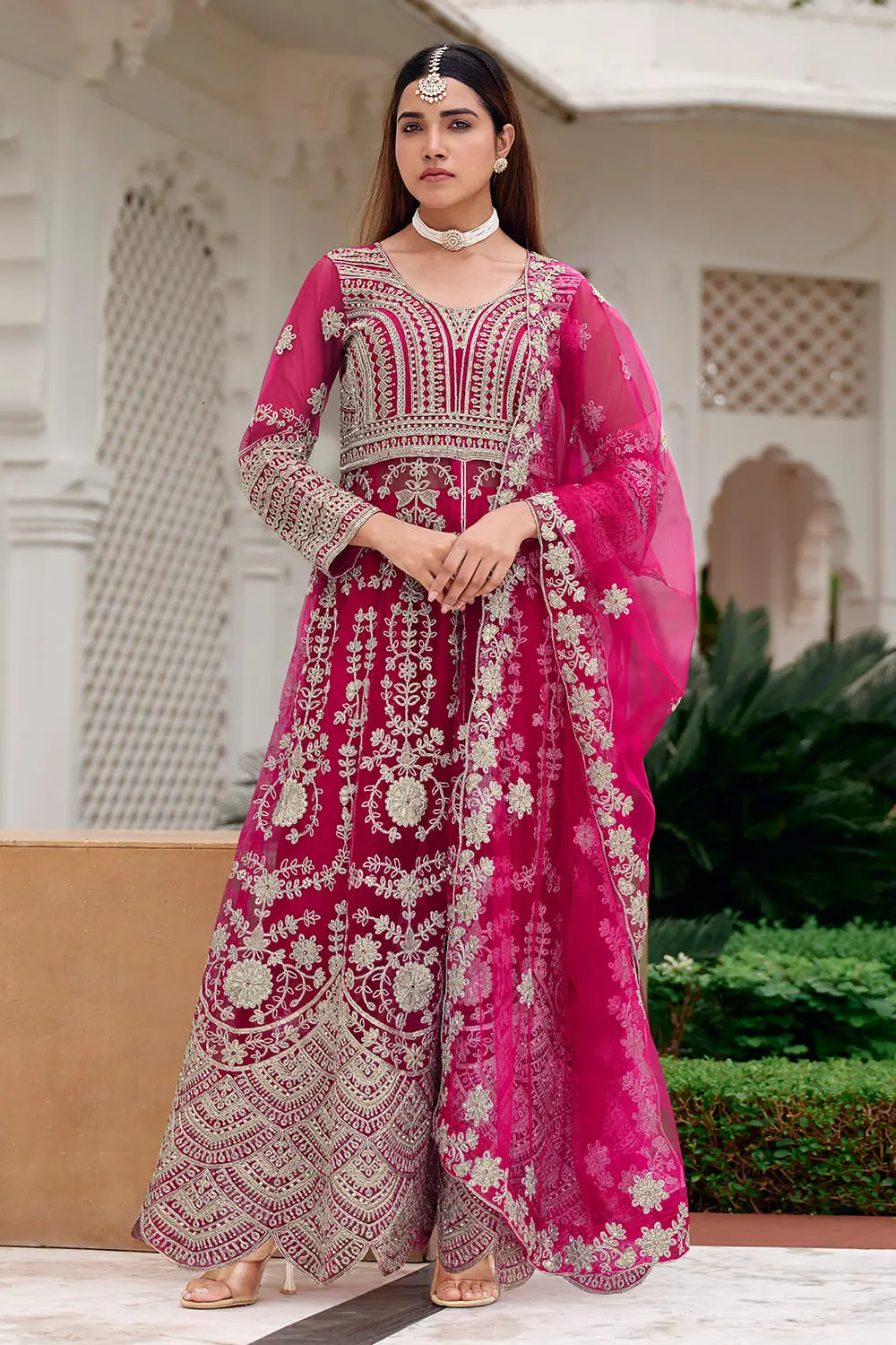 Pink anarkali dress styled with fitted santoon pant bottom