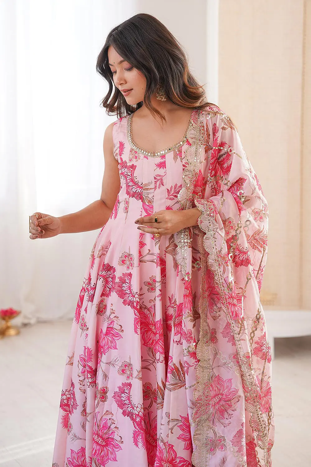 Side view of pink floral muslin anarkali gown with pant