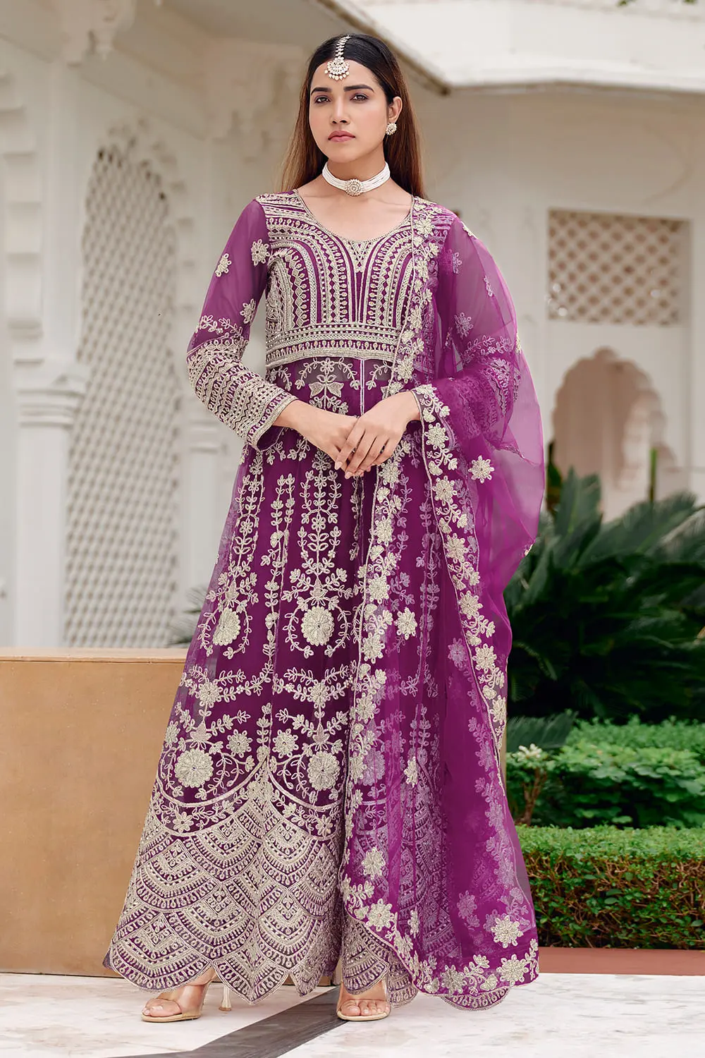 Purple butterfly net anarkali styled with flared skirt and net dupatta