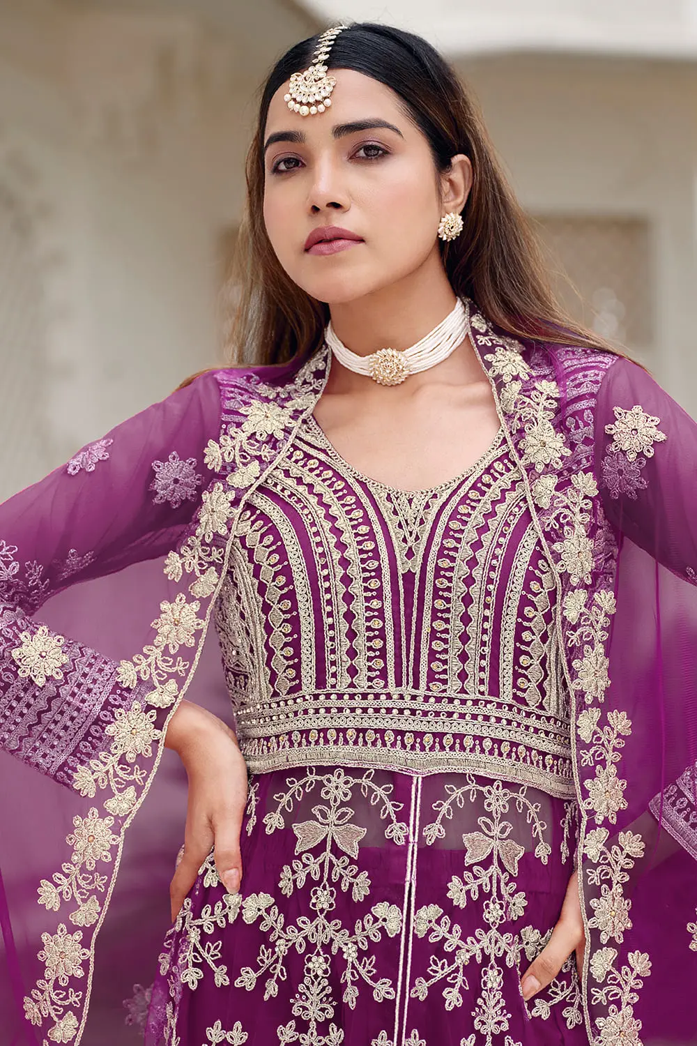 Heavy front embroidery and stone work on purple butterfly net anarkali