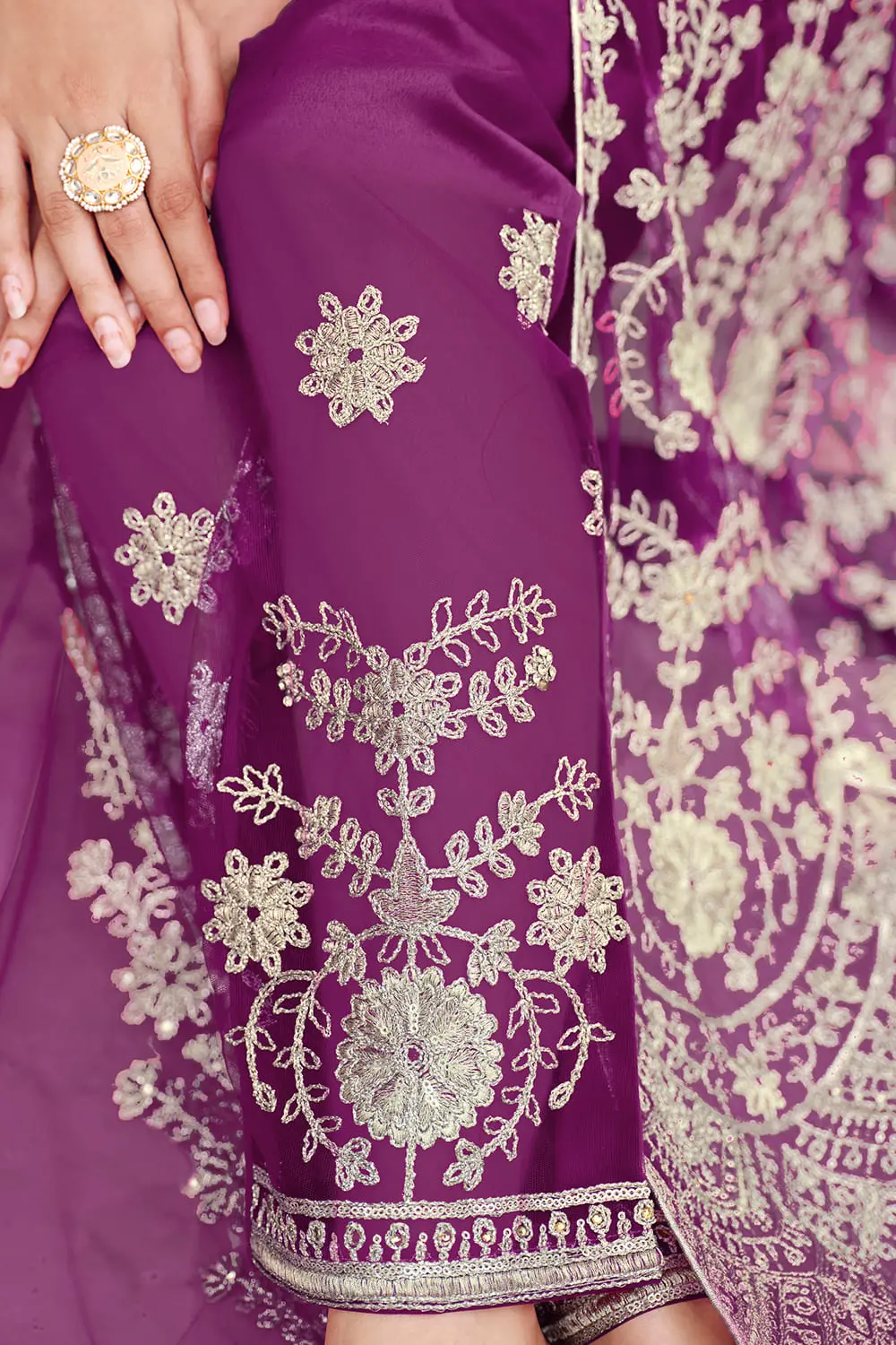 Detailed back embroidery on purple net anarkali suit for party