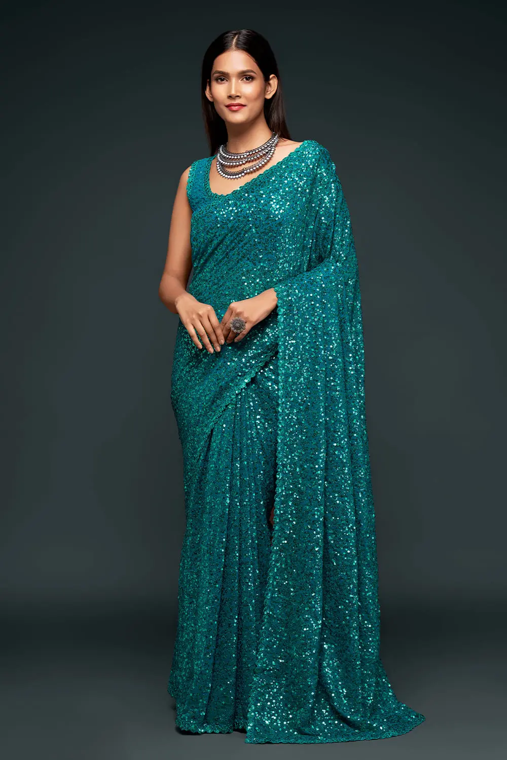 Teal blue sequin georgette saree with pallu draped full view