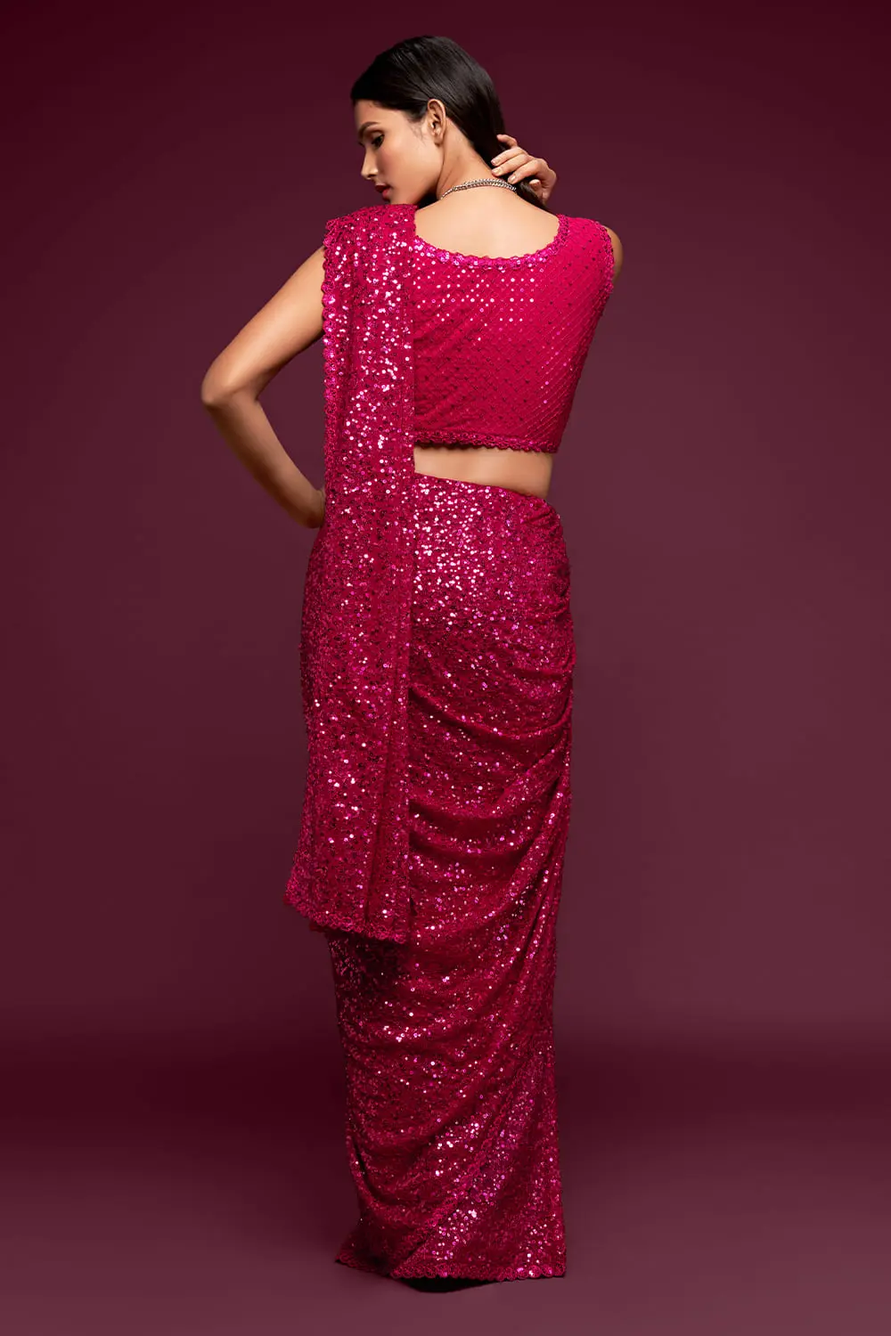 Back view of hot pink georgette saree with sequin work