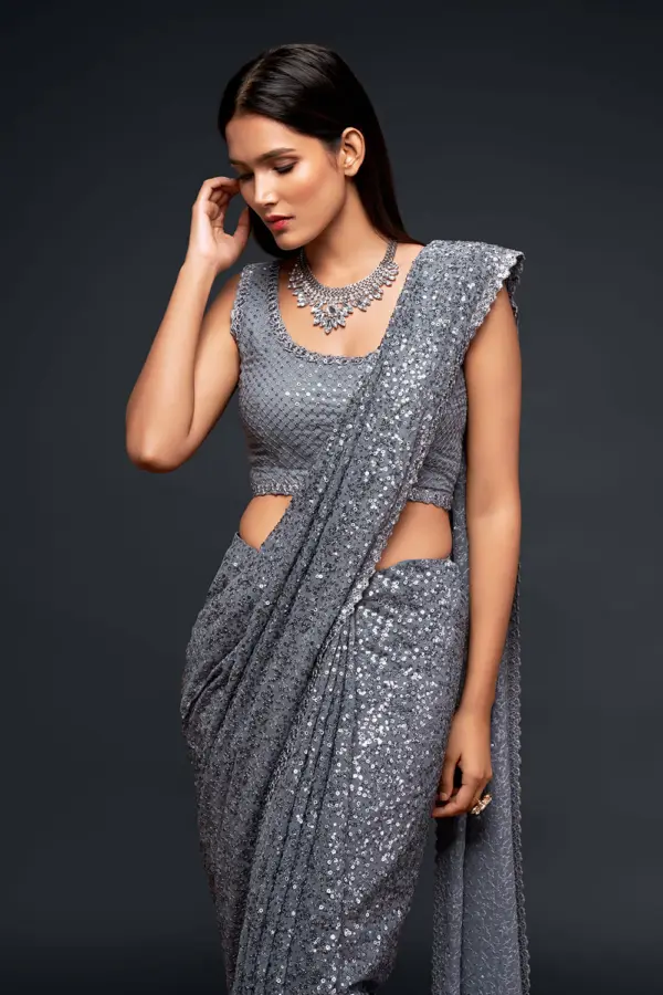 Close up of thread embroidery and multiple sequins on slate grey saree
